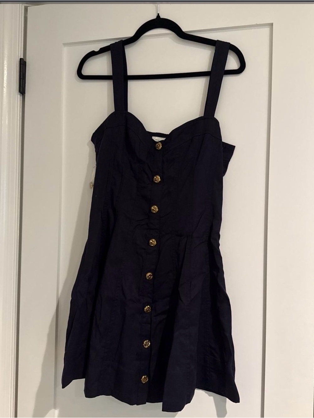 AQUA Women’s navy blue mini dress with gold buttons.